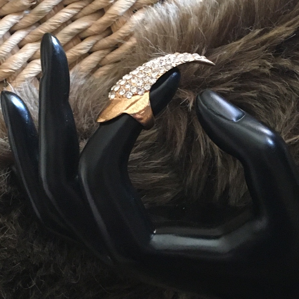 Rhinestone covered gold tone claw fingertip ring